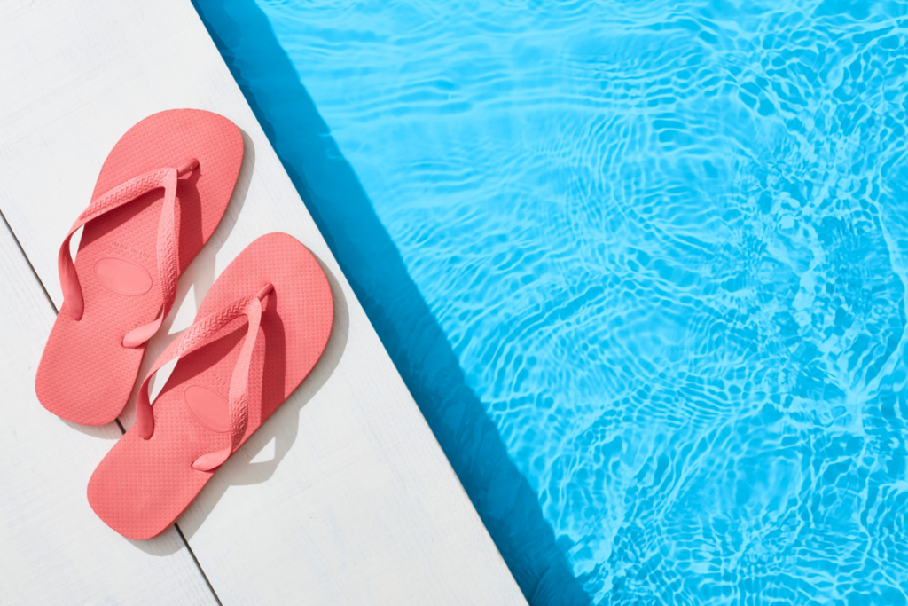 empty pool side and flip flops