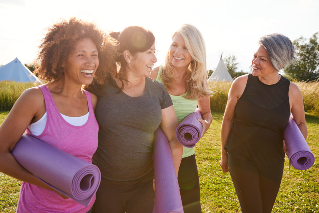 Active women in their 40s and 50s yoga, flexibility training and balance